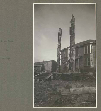Tlingit totem poles in front of house, Wrangell, Alaska, June 1899., Taken on 1 June 1899