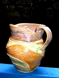 Multi colors ceramic pitcher.