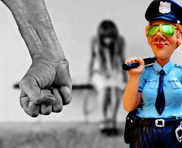Violence against women police arrest. Free illustration for personal and commercial use.