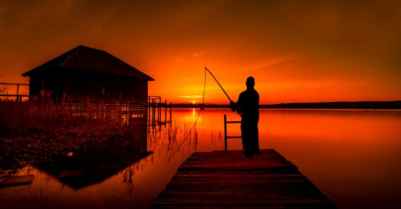 Silhouette of Fisherman. Free illustration for personal and commercial use.