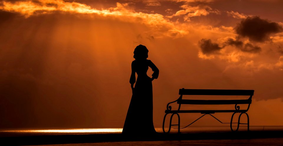 Woman Silhouette at Sunset. Free illustration for personal and commercial use.