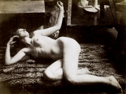 Nude Photography, study of a female nude model, lying on a tiger skin, in the studio of Jacques de Lalaing (ca. 1895–1898). Original from The Rijksmuseum. Digitally enhanced by rawpixel.