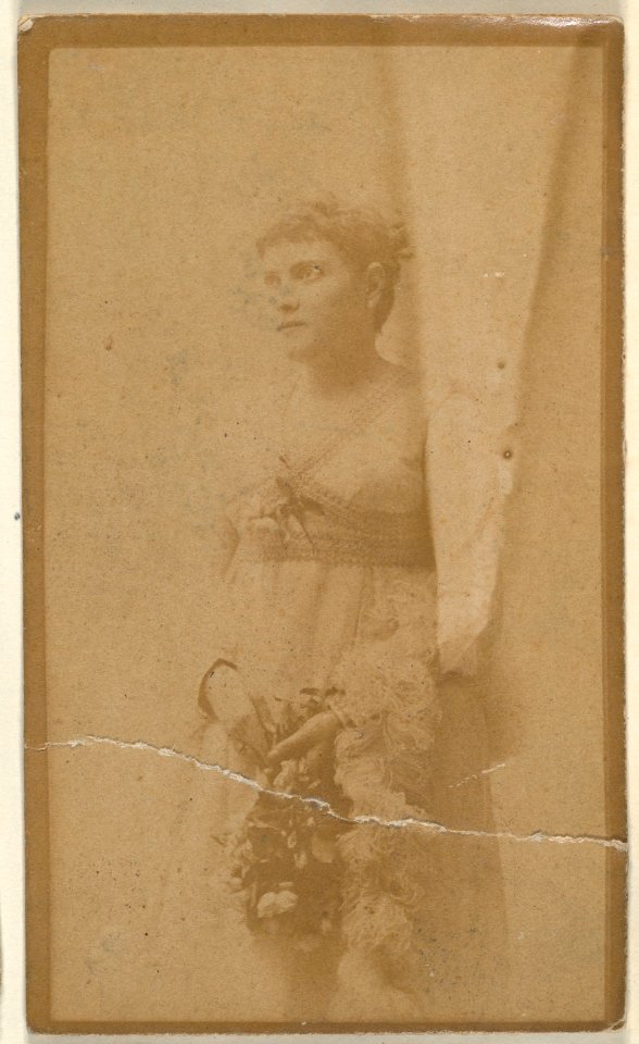 Actress holding headpiece of floral vines, from the Actresses series (N668) MET DPB869952