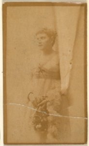 Actress holding headpiece of floral vines, from the Actresses series (N668) MET DPB869952