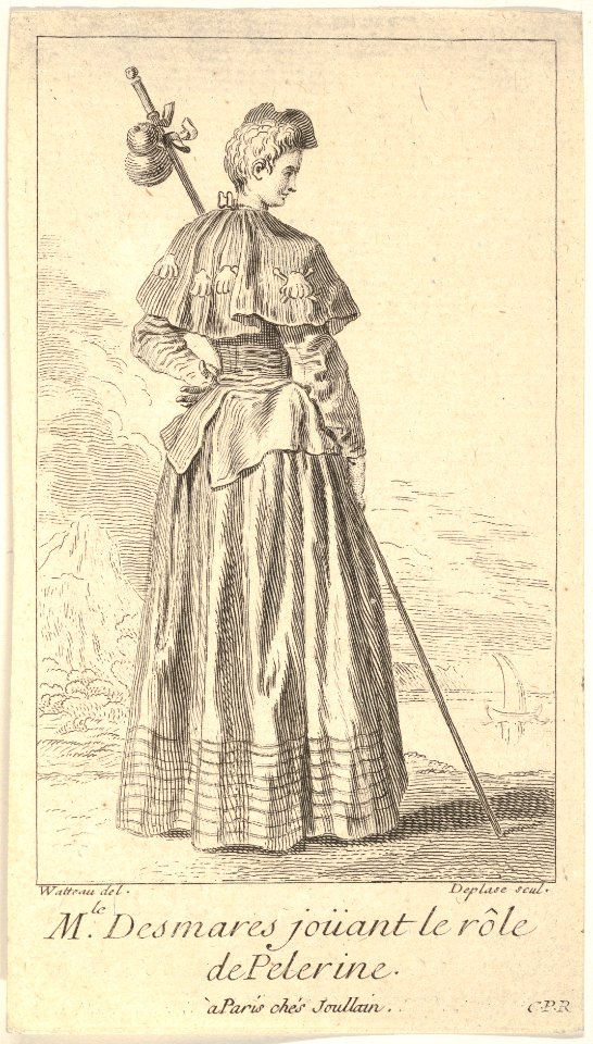 Actress Charlotte Desmares playing the role of a pilgrim, shown from behind with her head turned toward the right, she holds a walking stick, scallop shells adorn her cape MET DP834135