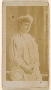 Actress in profile dressed in white gown, from the Actresses series (N245) issued by Kinney Brothers to promote Sweet Caporal Cigarettes MET DP859952