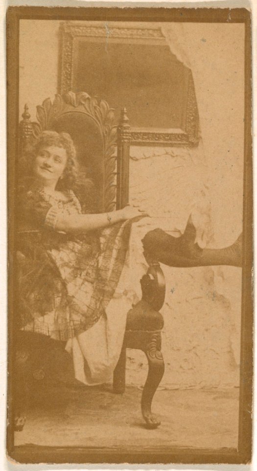 Actress posing on chair with legs resting on armrest, from the Actresses series (N664) promoting Old Fashion Fine Cut Tobacco MET DPB869689
