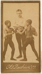Man standing with two children boxing, from the "Negro Subjects" series (N692) promoting Old Fashion Fine Cut Tobacco MET DPB870034