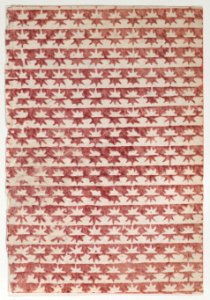 Sheet with overall red star pattern Met DP887068