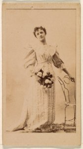 Woman standing with hand on chair, from the Actresses series (N245) issued by Kinney Brothers to promote Sweet Caporal Cigarettes MET DP859941