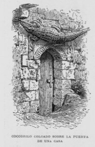 "Cocodrilo colgado sobre la puerta de una casa"