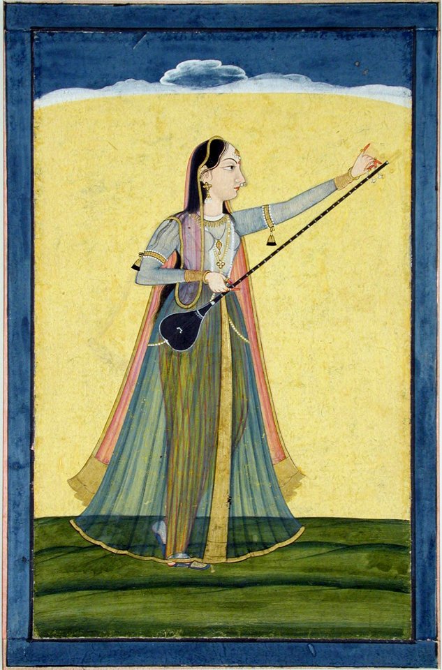 A woman tunes her tambura (6124588073)