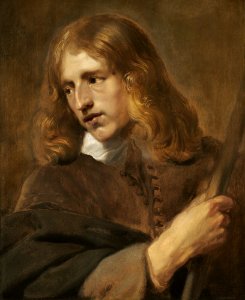 A Young Man Holding a Staff A14662