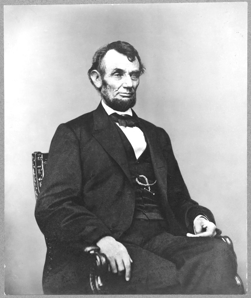 Abraham Lincoln, three-quarter length portrait, seated, facing right; hair parted on Lincoln's right side LCCN2009630693