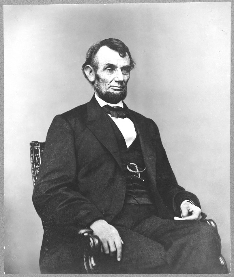 Abraham Lincoln, three-quarter length portrait, seated, facing right; hair parted on Lincoln's right side LCCN2009630693