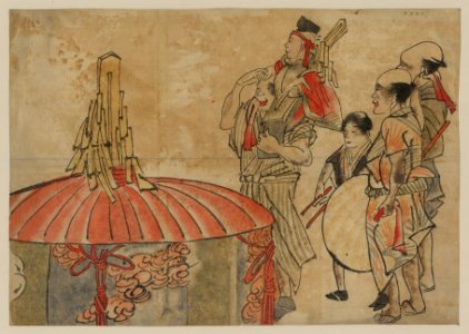 Actors or musicians standing next to a large, decorated cylindar with cover; one man is carrying another on his shoulders LCCN2009630003