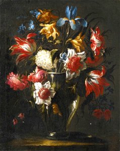 'Blue Irises, Parrot Tulips, Anemones, Peonies and Other Flowers in a Glass Vase, on a Stone Ledge' by Juan de Arellano