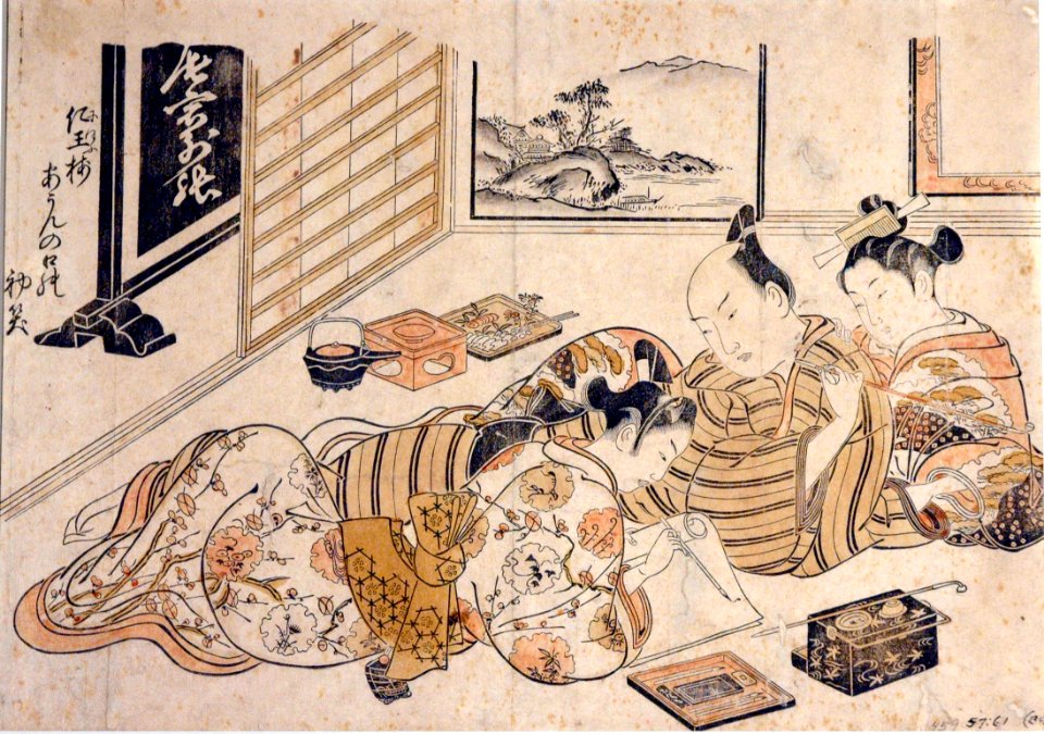 A man and a woman watching a young man write (5758871459)