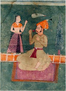 A seated Raja, kneeling on a rug and smelling a rose (6124566005)