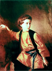 Boy in orange shirt by I.Makarov (1890s). Free illustration for personal and commercial use.