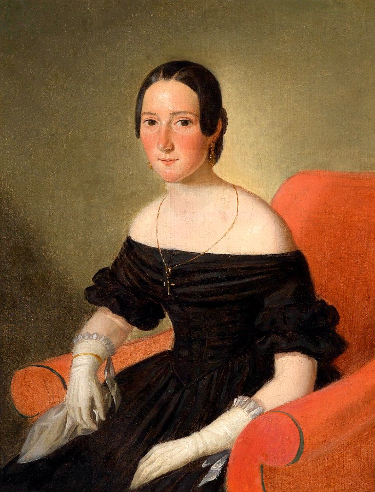 Dame in einem roten Samtsessel sitzend c1850