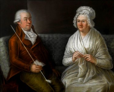 Anonymous Elderly couple sitting on a sofa