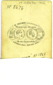 54. Guttedrakt, samedrakt, Vadsø. Portrett av gutt med pelsvest og hodeplagg ant - Norsk folkemuseum - NF.08676-002 (2)