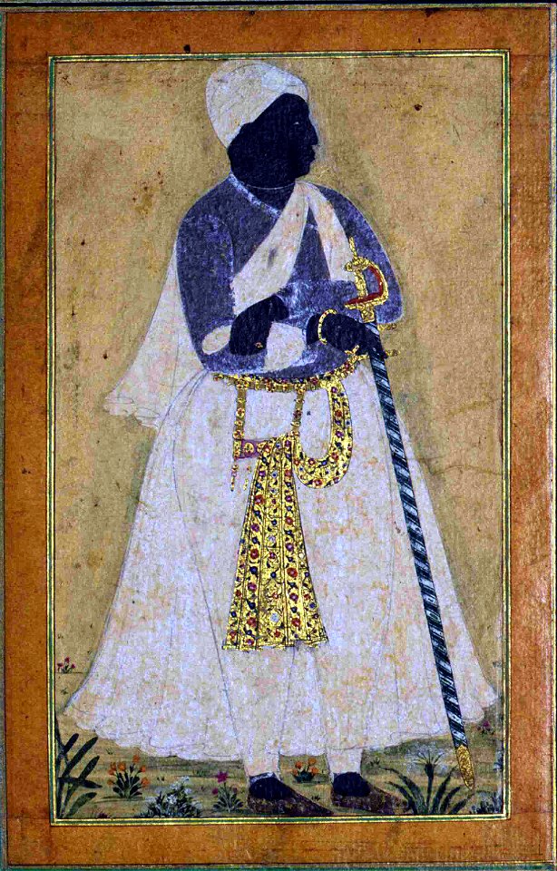 A Black Man Leans on a Long Staff (6125084816)