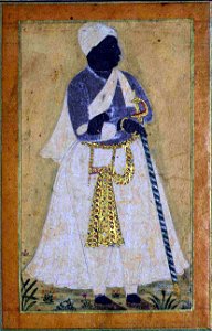 A Black Man Leans on a Long Staff (6125084816)