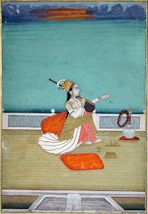 A beautiful woman seated on a terace playing a vina (6125107314)