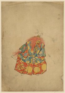 A clown wearing colorful costume and mask, with wild hair and hat with animal on top, and holding a rattle LCCN2009630018