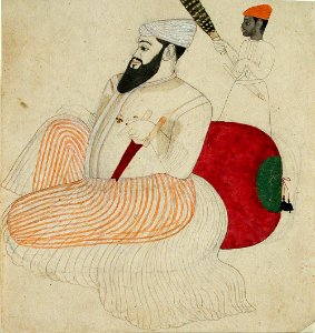 A fat, bearded ruler seated against a bolster, attended by a black chauri beare (6125087336)