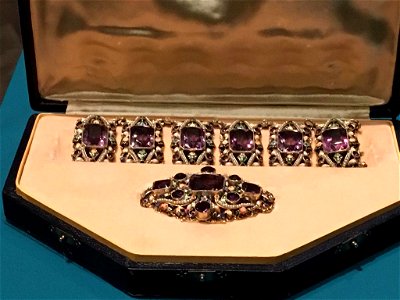 Brooch and bracelet with purple amethyst in case