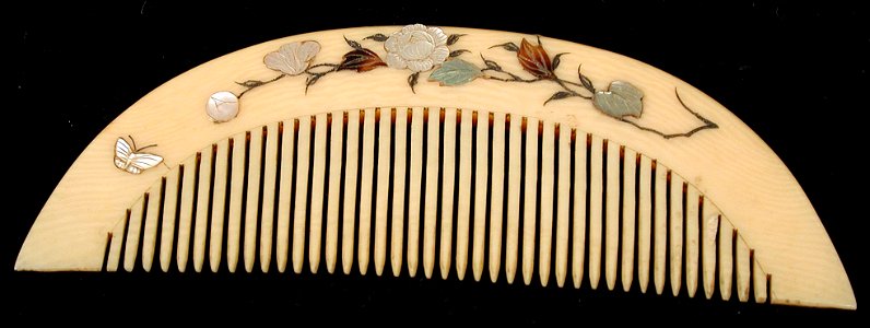 Comb (floral and butterfly designs on handle) (5765900660)