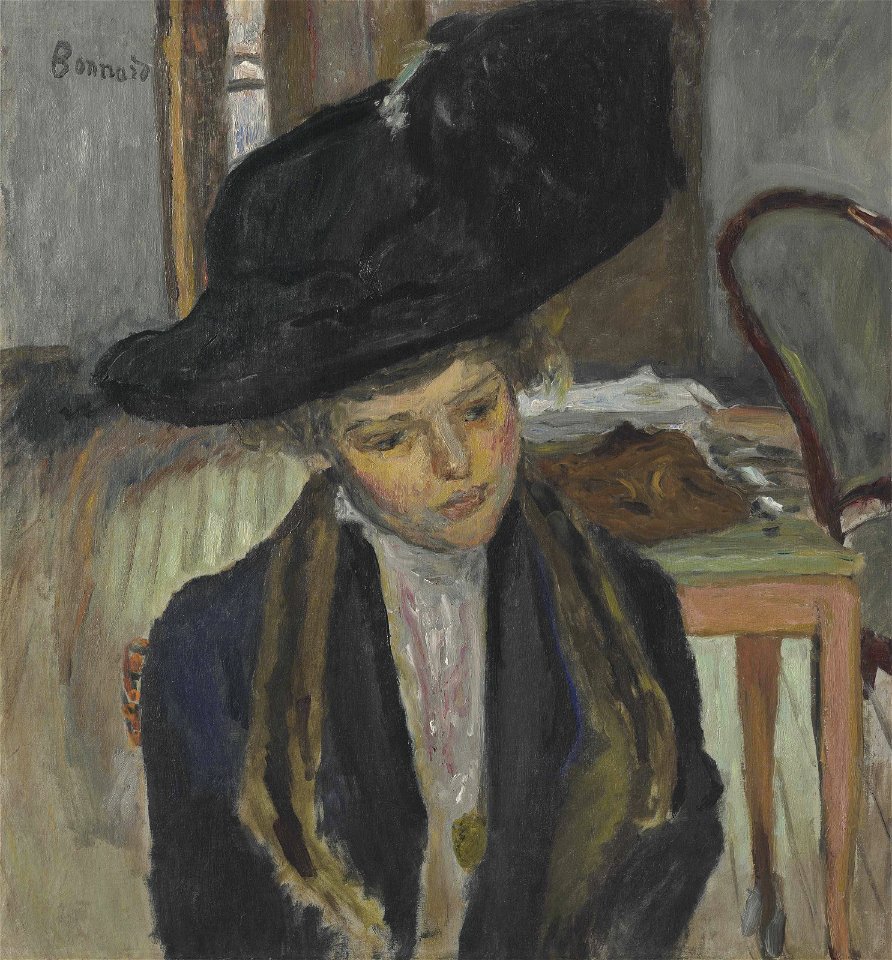 Jeune femme au chapeau noir