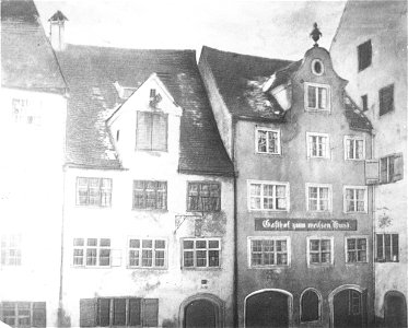 Gasthaus um weißen Hund