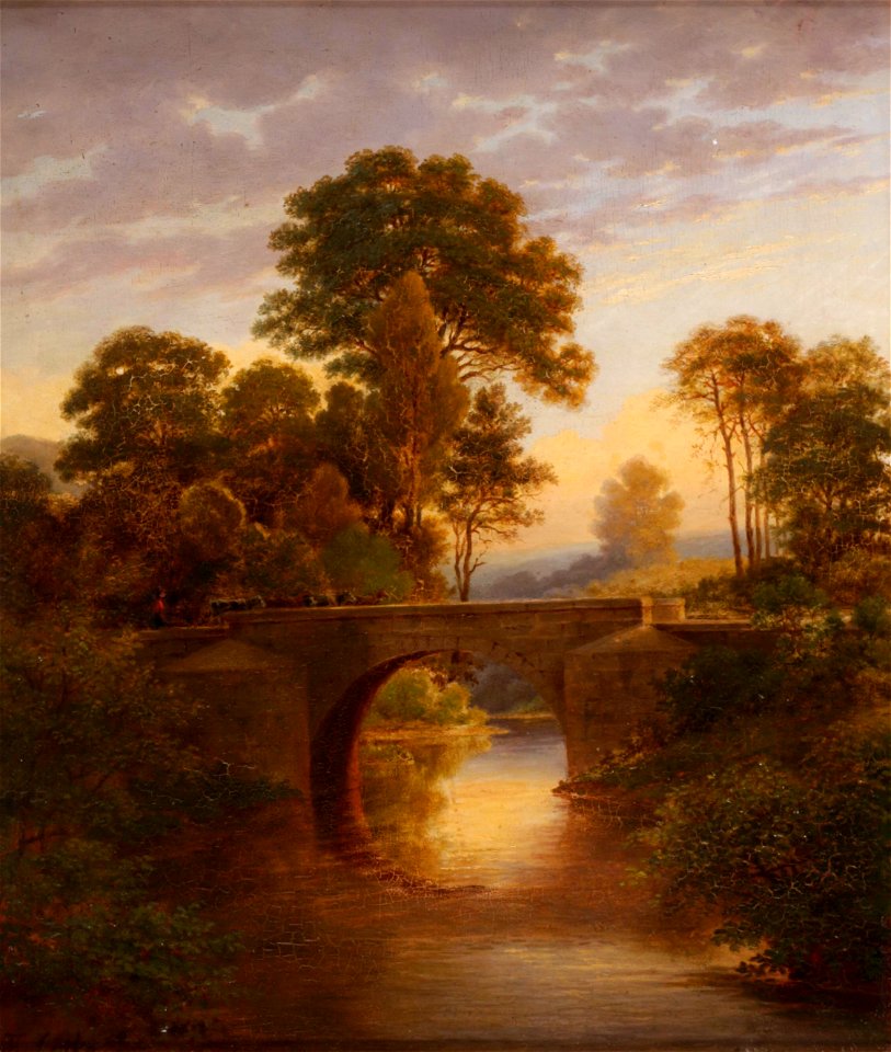 Eine Steinbrücke mit passierender Rinderherde