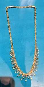 Extendible gold necklace with two clasps