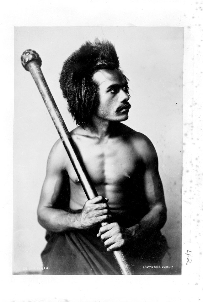 Fijian man holding a club, photograph by Burton Brothers, 1884, b&w negative