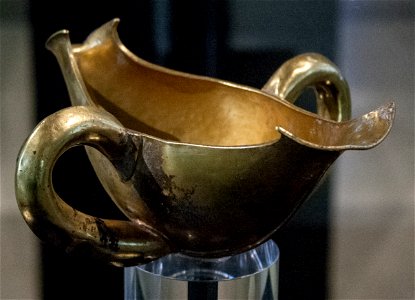 Golden sauceboat with two handles