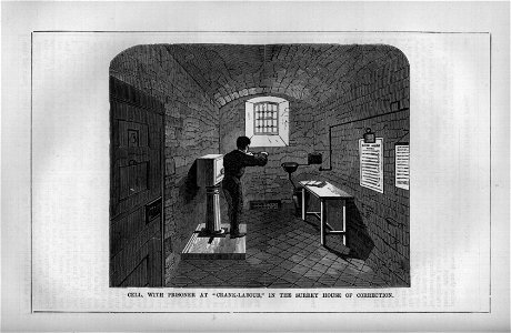 Cell, with Prisoner at Crank-Labour, In the Surrey House of Correction. Free illustration for personal and commercial use.