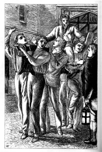 Group of boys carrying a boy on their shoulders