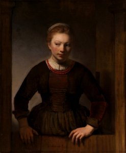 Samuel van Hoogstraten - Young woman at an open half-door (1645)