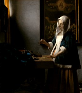 Johannes Vermeer - Woman Holding a Balance - 001