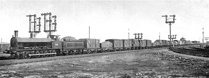 LNWR goods train leaving Crewe (Howden, Boys' Book of Locomotives, 1907). Free illustration for personal and commercial use.