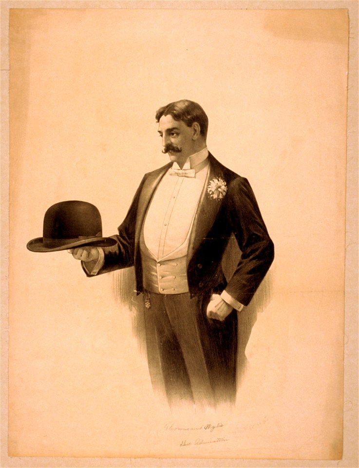 Man wearing tuxedo, holding bowler hat LCCN2014636873