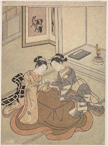 Mma two young women seated by a kotatsu playing cats cradle 55802