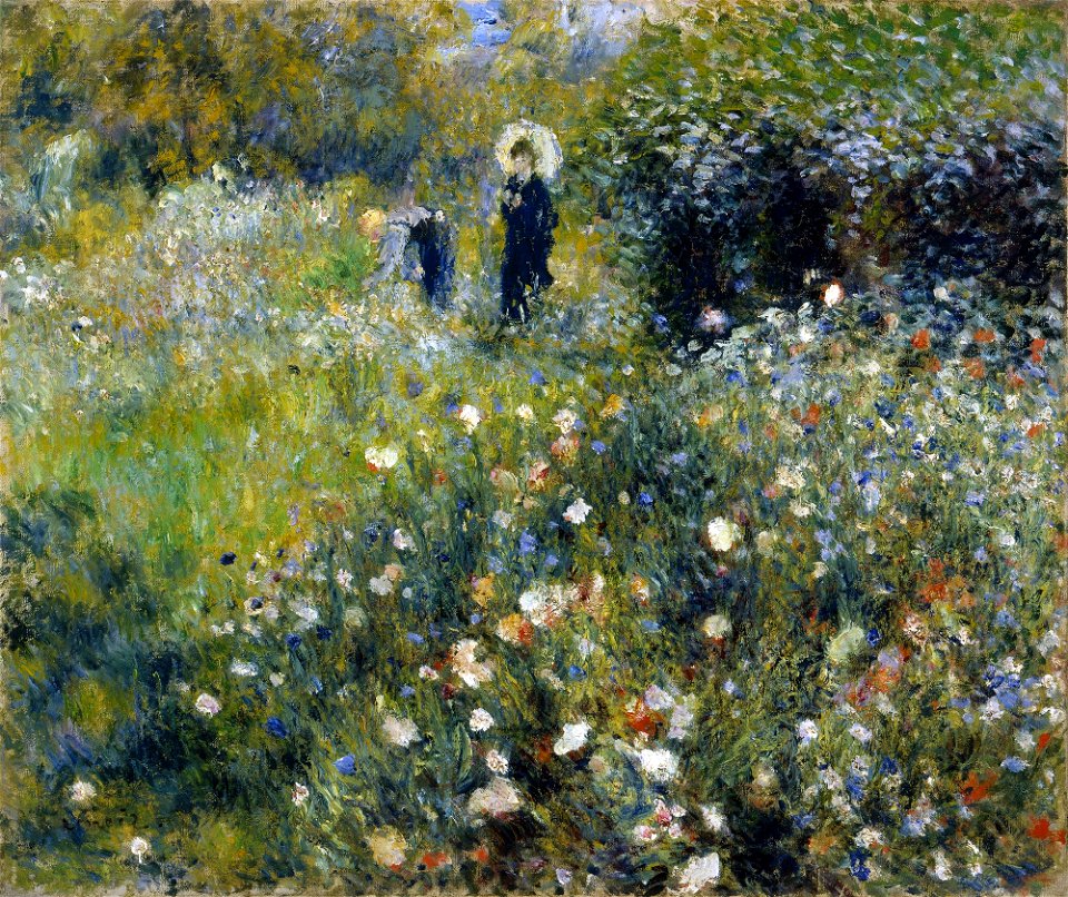 Mujer con sombrilla en un jardín