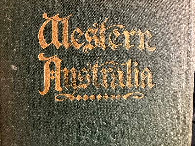 Part of worn cover of the 1925 edition of Western Australia an official handbook. Free illustration for personal and commercial use.