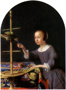 Pieter van Slingeland - A girl feeding a parrot a nut